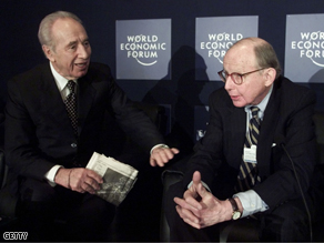 Israeli Foreign Minister Shimon Peres (L) talks with Samuel P. Huntington of Harvard University.