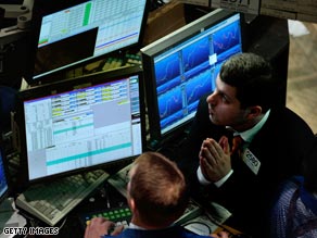 A trader watches the market moves on the floor of the New York Stock Exchange on Monday.