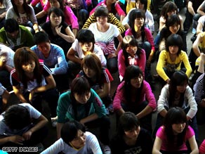 Young migrant workers crowd a Shenzhen human resources office for job placement.