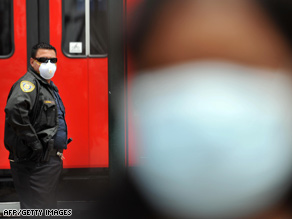 A transport security officer looks on near the U.S.-Mexico border in San Ysidro, California, on Monday.
