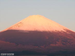 Mount Fuji glows red in the sunset, much like the year-end results of Japanese manufacturers.