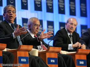 Arab League Secretary-General Amre Moussa, left, gestures at the World Economic Forum.