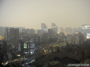 A thunderstorm shrouds Beijing's central business district on Tuesday.