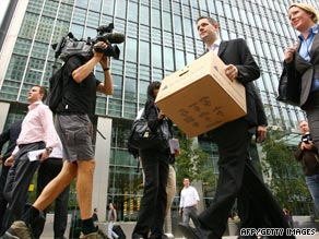 One year ago cameras caught shocked Lehman Brothers' employees leaving the building with boxes.