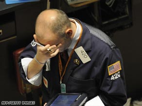 A New York trader reacts to the fall of global stock markets in September 2008.