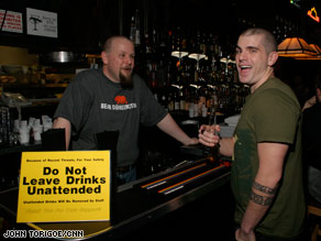 Alison Luying, left, and others walk outside CC Attle during the pub crawl.