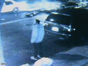 Surveillance video shows a body in the middle of the street.