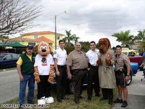 Jerry Borbon, Scruff, McGruff the Crime Dog and police officers at a Westchester neighborhood celebration.