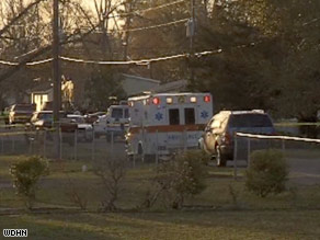 An ambulance rushes to the scene of the multiple shootings in Samson, Alabama, on Tuesday afternoon.