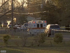 An ambulance rushes to the scene of the multiple shooting in Samson, Alabama, on Tuesday afternoon.