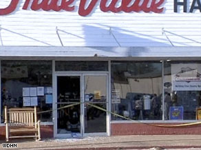 An ambulance rushes to the scene of the multiple shooting in Samson, Alabama, on Tuesday afternoon.