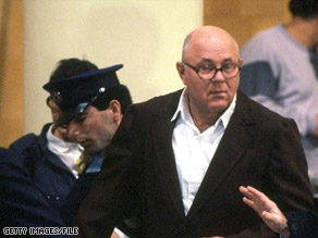 John Demjanjuk appears in court in Jerusalem in 1987 on charges of war crimes and crimes against humanity.