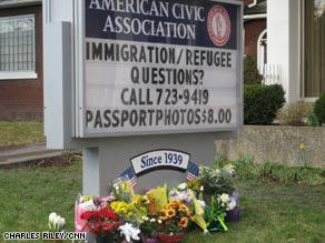 Flowers in honor of those killed lay outside the American Civic Association on Sunday.