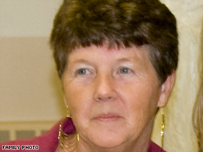 Secretary Shirley DeLucia, shot in the stomach, crawled under her desk and dialed 911.