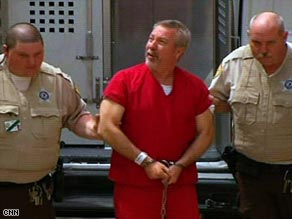 A judge delayed Drew Peterson's arraignment until May 18 because his lawyers couldn't attend Friday's hearing.