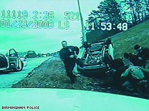 Video shows one black and four white officers beating and kicking unconscious man ejected from car.