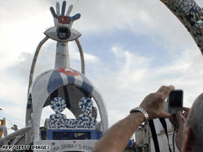 A man takes a picture  in September of a sculpture in honor of the Cuban Five in Havana, Cuba.