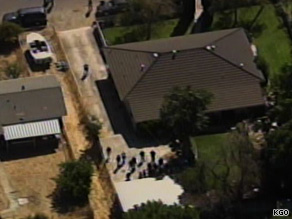 Officials search the property of Phillip Garrido, who police say kept an abducted girl in a shed for 18 years.