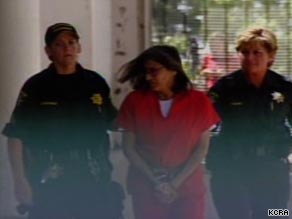Nancy Garrido is escorted by police in Placerville, California, after her arrest last week.