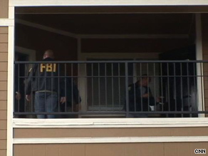 FBI agents search the apartment of Najibullah Zazi on Wednesday in connection with a terror investigation.