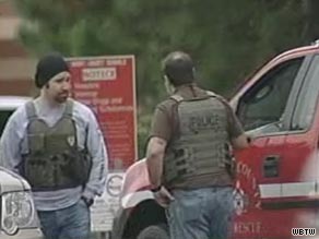 Police officers in body armor vests are on the scene after violence at a school near Myrtle Beach, South Carolina.