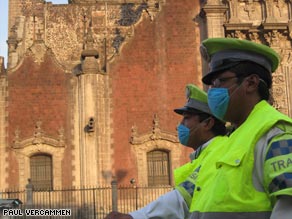 Police keep worshippers from attending Mass at a cathedral in Mexico City on Sunday.