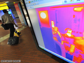 International arrivals have their temperature checked as they pass a thermal scanner at Jakarta's main airport.