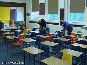 Workers clean a classroom in Fort Worth, Texas, on Thursday as schools were closed because of swine flu.