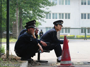 Security guards outside a sealed-off hotel in Beijing on Monday, where Mexican nationals were quarantined.