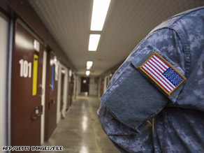 A U.S. miliary guard stands inside the Camp V area at the U.S. Naval Base in Guantanamo Bay, Cuba, in 2006.