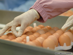 Researchers in Taiwan sort through eggs for a swine flu vaccine. Companies worldwide are working on vaccines.