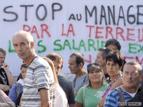 France Telecom employees protest against work conditions following a colleague's suicide.