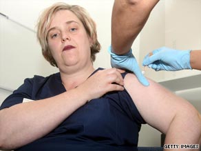 A British nurse receives the swine flu vaccine at the University College London Hospital in London, England.