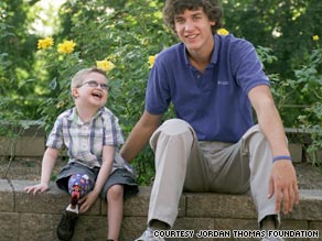 Noah Parton, 6, got prosthetics from foundation started by Jordan Thomas, right.