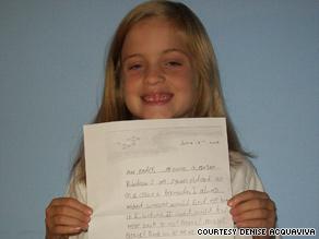 Teddy Herrick, 11, opens the letter shortly after she retrieved it from Massachusetts' Vineyard Sound.