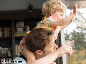 One father didn't let his new baby slow him down. He would strap him to his chest and take him to a ball game.