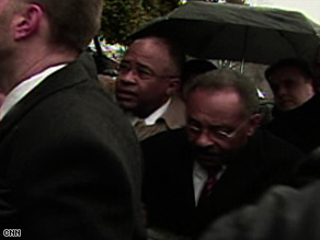Roland Burris makes his way to the Senate chambers on Tuesday.