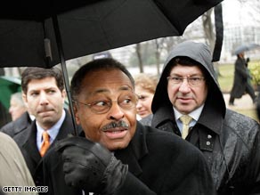 Former Illinois Attorney General Roland Burris makes his way to the Capitol on Tuesday.