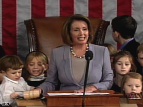 Speaker Nancy Pelosi, surrounded by her grandchildren, swears in the members of the House.