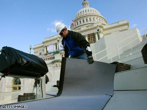 Workers are putting the finishing touches on the innaugural stage on the steps of U.S. Capitol.