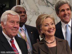 Sen. Hillary Clinton testifies before the Senate Foreign Relations Committee as her daughter, Chelsea, looks on.