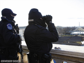 U.S. Capitol Police check observation positions in advance of Tuesday's presidential inauguration.