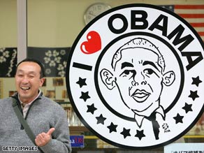 A man in Obama, Japan, Tuesday gets a kick out of a poster for the new American president of the same name.