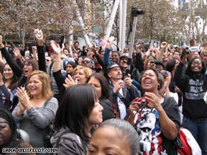 A diverse crowd in Los Angeles, California, cheers as Barack Obama takes the oath of office Tuesday.