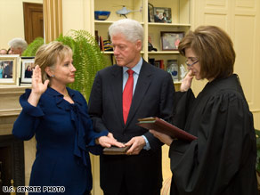 Hillary Clinton gets sworn in Wednesday in her Senate office by Judge Kathryn Oberly.