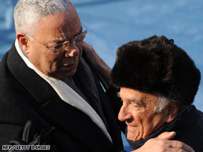 Colin Powell, left, embraces Nobel laureate Elie Wiesel at the inauguration Tuesday.