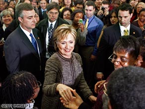 Secretary of State Hillary Clinton is welcomed to the State Department on Thursday.