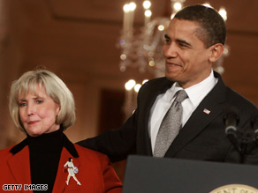 President Obama stands with Lilly Ledbetter shortly before he signed the bill bearing her name Thursday.