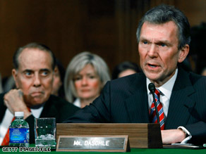 Former Sen. Tom Daschle answers questions during a confirmation hearing January 8.