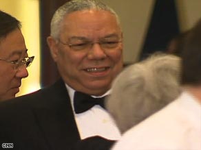 Colin Powell chats with other guests at the Alfalfa dinner in Washington on Saturday night.